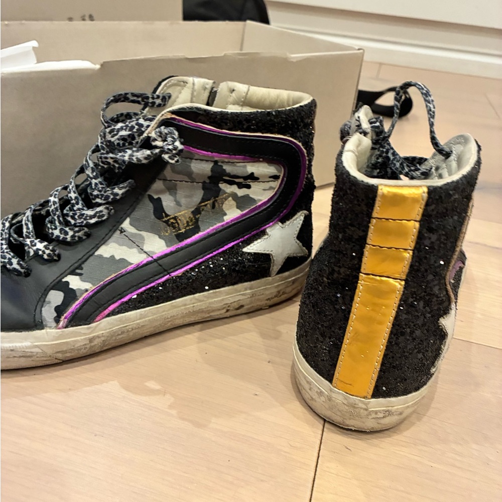 Golden Goose Black and Gold Sneakers with Star Accent